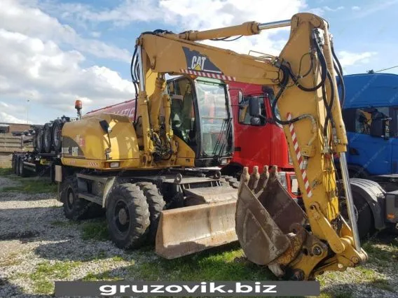 Экскаватор Caterpillar M313 2006 года б/у
