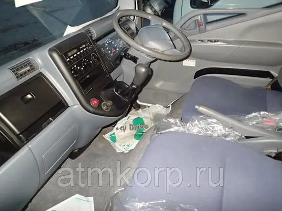 Тентованный грузовик Mitsubishi CANTER FB70B 2010 года б/у фото 4