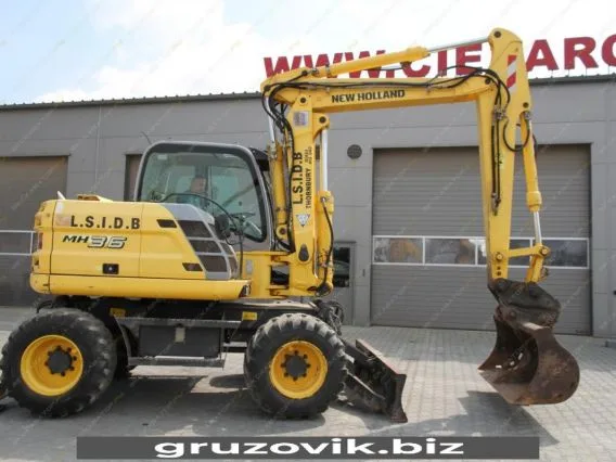 Экскаватор New Holland MH 3.6 2010 года б/у фото 19