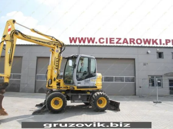 Экскаватор New Holland MH 3.6 2010 года б/у фото 22