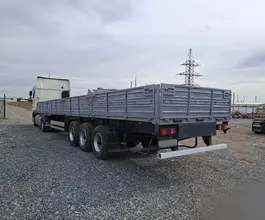 Бортовой полуприцеп МАЗ 975800 2012 года б/у фото 3