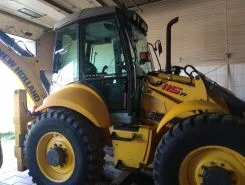 Экскаватор-погрузчик New Holland B115B 2011 года б/у